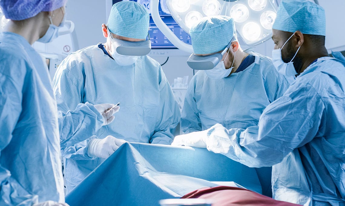 Surgeons wearing virtual reality glasses